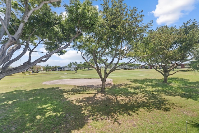 view of grassy yard with view of golf course