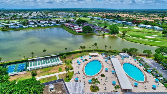 aerial view of a large body of water, a pool, and a golf course