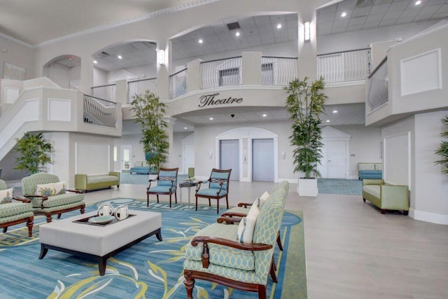 building lobby featuring a high ceiling and recessed lighting