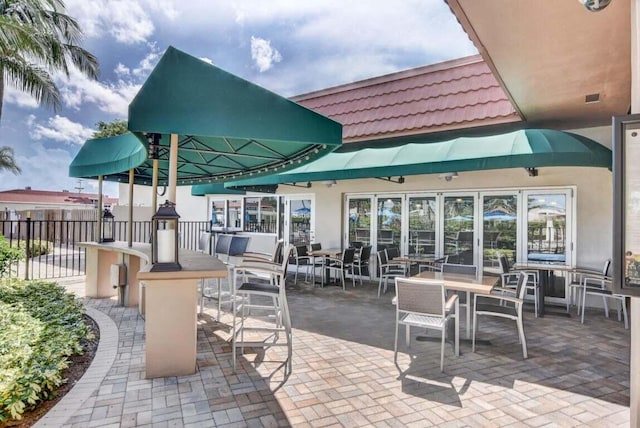 view of patio / terrace featuring fence