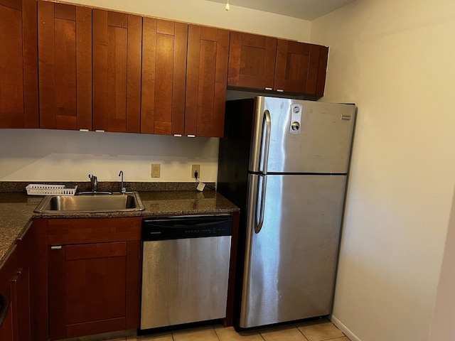 3101 N Country Club Dr Unit 510, Aventura, FL 33180 - kitchen featuring appliances with stainless steel finishes, a sink, dark countertops, and light tile patterned flooring