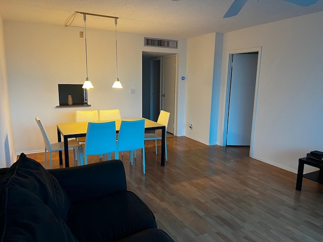 3101 N Country Club Dr Unit 510, Aventura, FL 33180 - dining area featuring a ceiling fan, wood finished floors, baseboards, and a textured ceiling