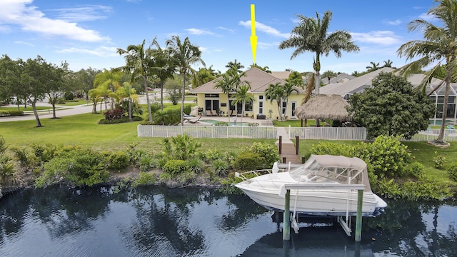 dock area with a water view and boat lift
