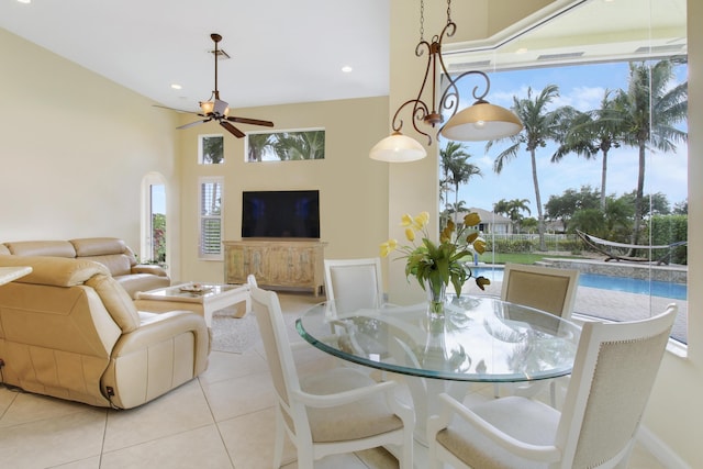 tiled dining area featuring ceiling fan and recessed lighting