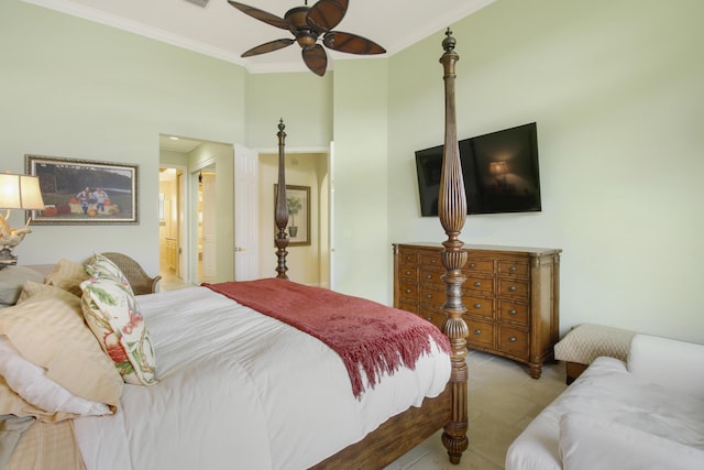 bedroom with crown molding, a ceiling fan, connected bathroom, and a towering ceiling