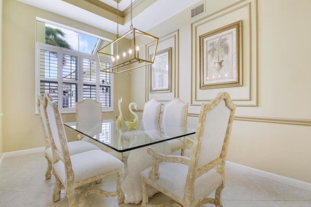 tiled dining space with a chandelier, healthy amount of natural light, and baseboards