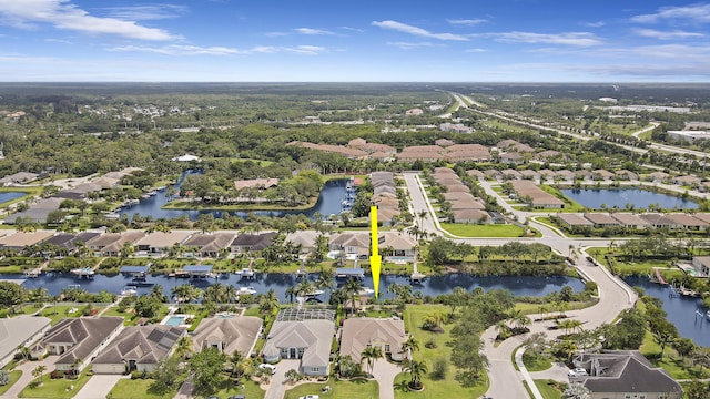 view of property location featuring nearby suburban area and a nearby body of water