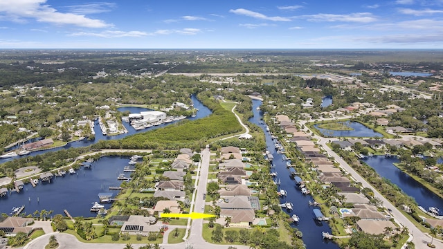 aerial overview of property's location featuring nearby suburban area and a large body of water