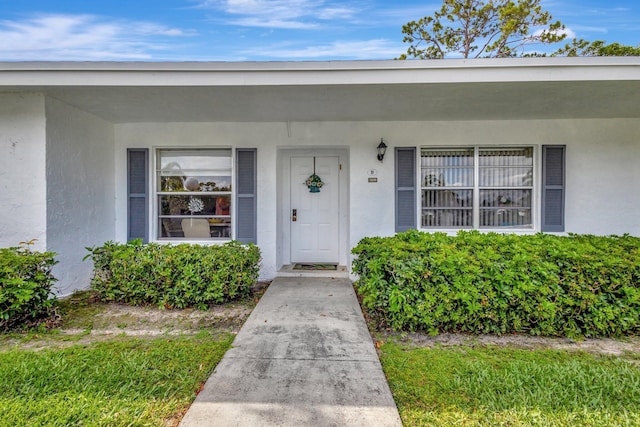 5200 Privet B Pl Unit B, Delray Beach, FL 33484 - view of exterior entry with stucco siding