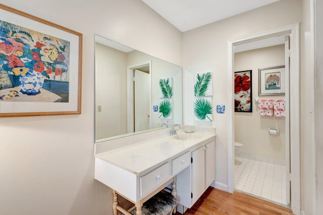 5200 Privet B Pl Unit B, Delray Beach, FL 33484 - bathroom with toilet, baseboards, wood finished floors, and vanity