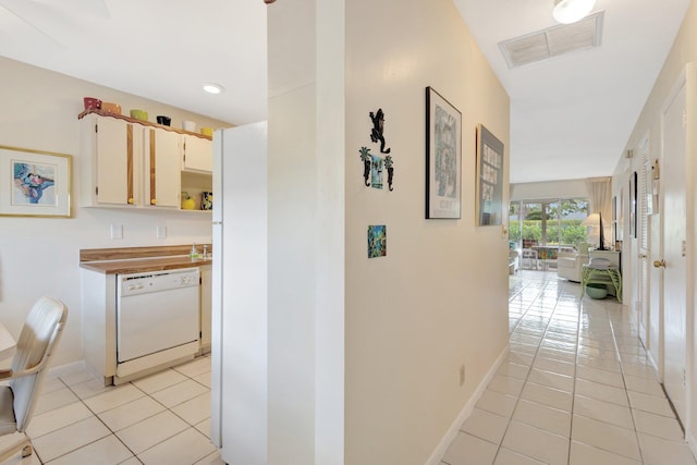 5200 Privet B Pl Unit B, Delray Beach, FL 33484 - corridor featuring light tile patterned flooring, baseboards, and recessed lighting