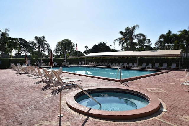 5200 Privet B Pl Unit B, Delray Beach, FL 33484 - community pool featuring a hot tub, fence, and a patio area