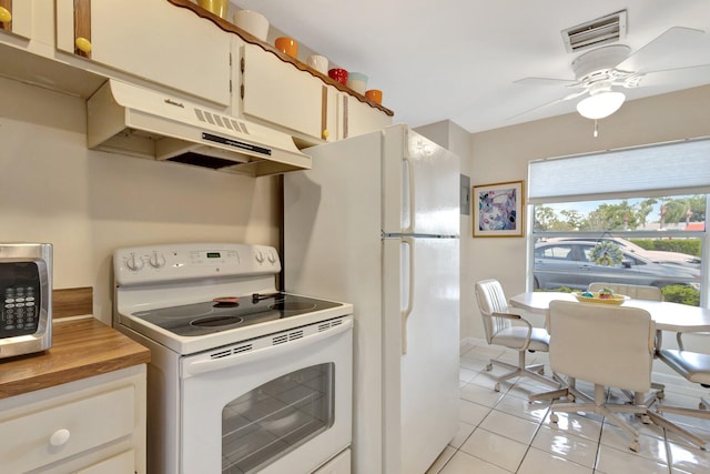 5200 Privet B Pl Unit B, Delray Beach, FL 33484 - kitchen featuring white appliances, under cabinet range hood, light tile patterned floors, ceiling fan, and white cabinetry