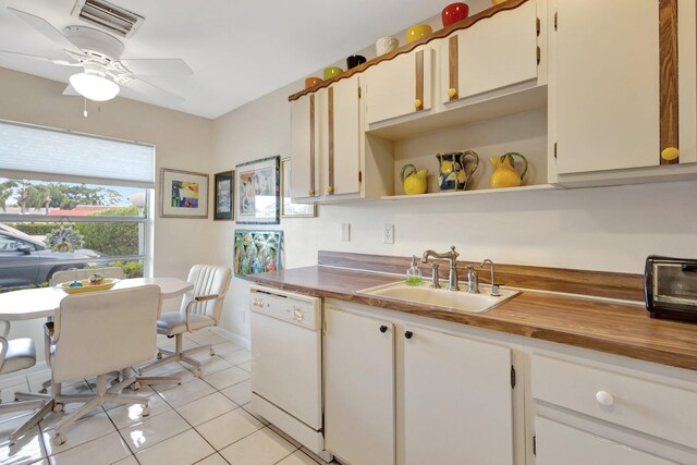5200 Privet B Pl Unit B, Delray Beach, FL 33484 - kitchen with white dishwasher, a sink, light tile patterned floors, open shelves, and a ceiling fan