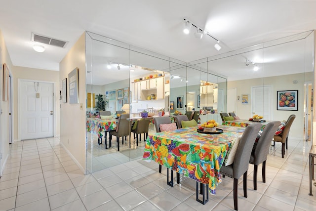 5200 Privet B Pl Unit B, Delray Beach, FL 33484 - dining room with light tile patterned flooring, rail lighting, and baseboards