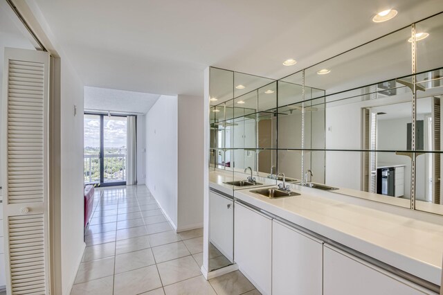123 Lakeshore Dr Unit 1644, North Palm Beach, FL 33408 - indoor wet bar featuring baseboards, light tile patterned flooring, and recessed lighting