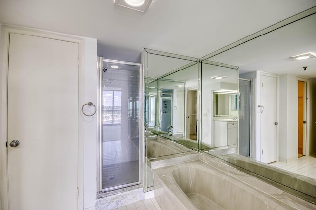 123 Lakeshore Dr Unit 1644, North Palm Beach, FL 33408 - full bath with a stall shower, a garden tub, tile patterned flooring, and vanity