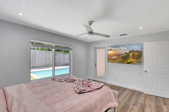 bedroom with wood finished floors, a ceiling fan, baseboards, and recessed lighting