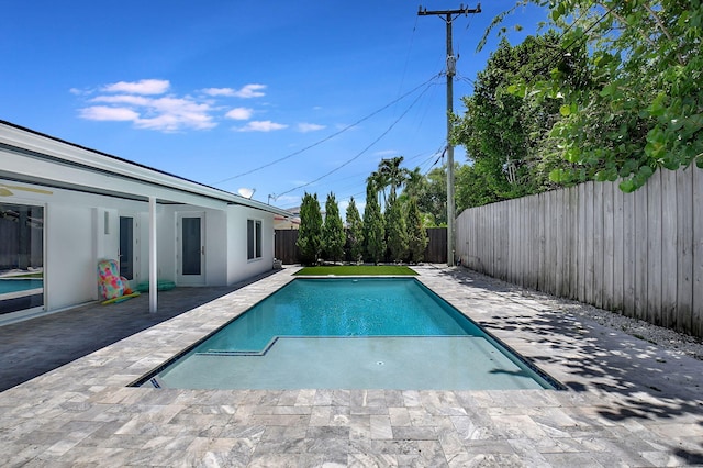 view of pool featuring a fenced backyard and a patio area