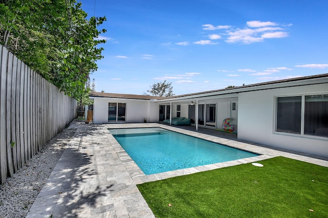 view of swimming pool with a patio