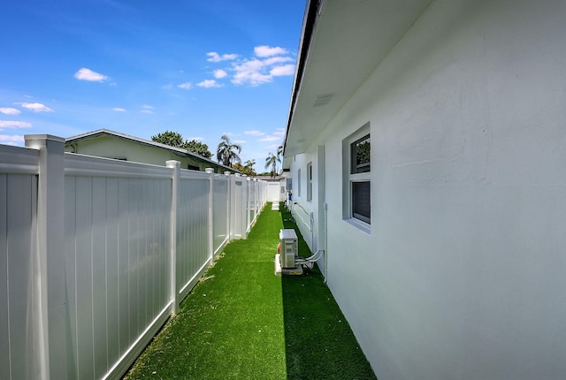 view of property exterior with cooling unit and stucco siding