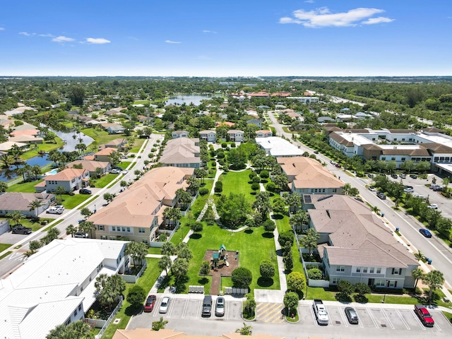 aerial perspective of suburban area featuring a nearby body of water