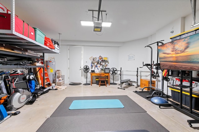 workout room featuring water heater and a garage