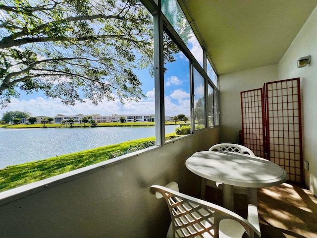 sunroom with a water view