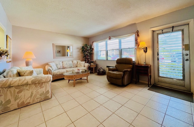 living room featuring light tile patterned floors and a textured ceiling