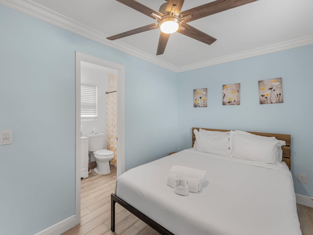629 N F St, Lake Worth Beach, FL 33460 - bedroom with crown molding, light wood-type flooring, baseboards, ceiling fan, and ensuite bathroom