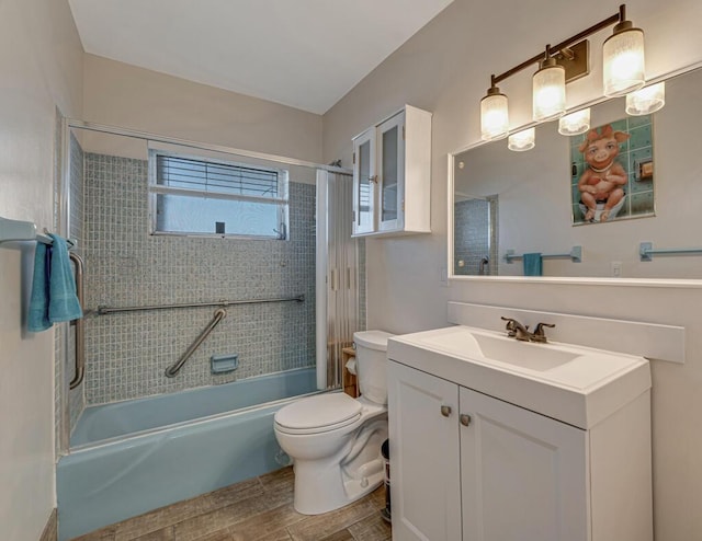 full bathroom with toilet, wood finished floors, bathtub / shower combination, and vanity