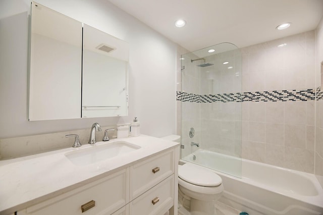 full bath featuring toilet, washtub / shower combination, vanity, and recessed lighting