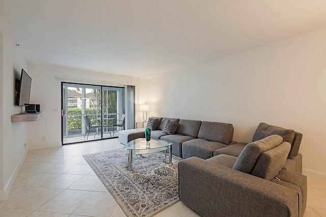 living room with light tile patterned floors and baseboards