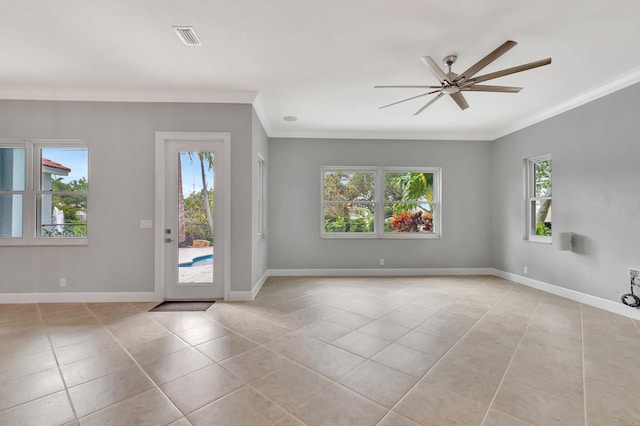 40 Country Lake Cir, Boynton Beach, FL 33436 - spare room featuring light tile patterned flooring, healthy amount of natural light, ornamental molding, ceiling fan, and baseboards