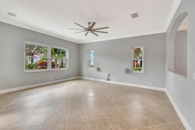 40 Country Lake Cir, Boynton Beach, FL 33436 - empty room featuring arched walkways, a ceiling fan, crown molding, light tile patterned floors, and baseboards