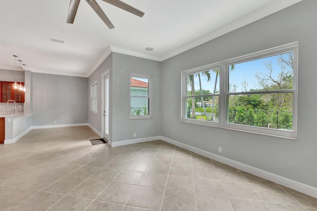 40 Country Lake Cir, Boynton Beach, FL 33436 - unfurnished living room featuring a sink, ornamental molding, light tile patterned floors, a ceiling fan, and baseboards