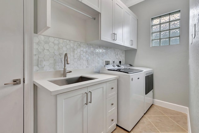 40 Country Lake Cir, Boynton Beach, FL 33436 - laundry room with separate washer and dryer, cabinet space, light tile patterned flooring, and baseboards