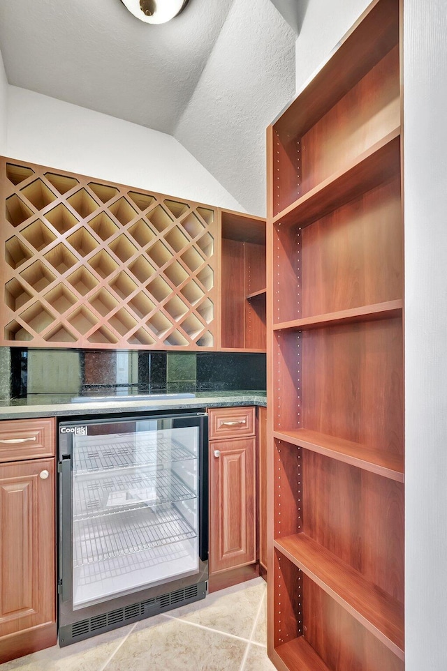 40 Country Lake Cir, Boynton Beach, FL 33436 - wine cellar featuring wine cooler, vaulted ceiling, and a bar