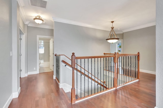 40 Country Lake Cir, Boynton Beach, FL 33436 - hallway featuring an upstairs landing, wood finished floors, ornamental molding, and baseboards