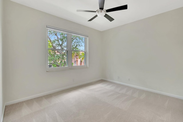 40 Country Lake Cir, Boynton Beach, FL 33436 - empty room with baseboards, light colored carpet, and a ceiling fan