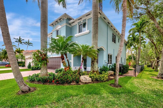 40 Country Lake Cir, Boynton Beach, FL 33436 - view of front of home with stucco siding, driveway, and a garage