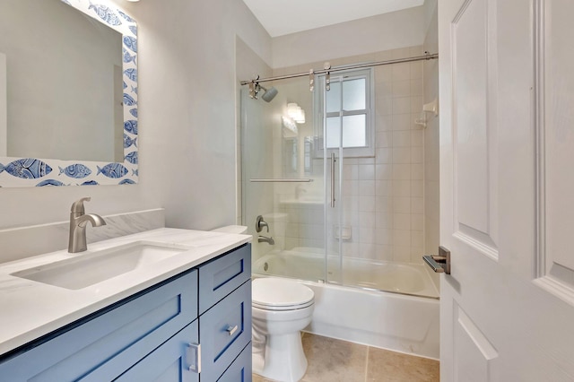 40 Country Lake Cir, Boynton Beach, FL 33436 - full bathroom featuring toilet, enclosed tub / shower combo, vanity, and tile patterned floors
