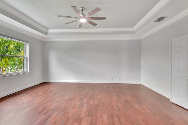 40 Country Lake Cir, Boynton Beach, FL 33436 - empty room with a raised ceiling, wood finished floors, ceiling fan, crown molding, and baseboards