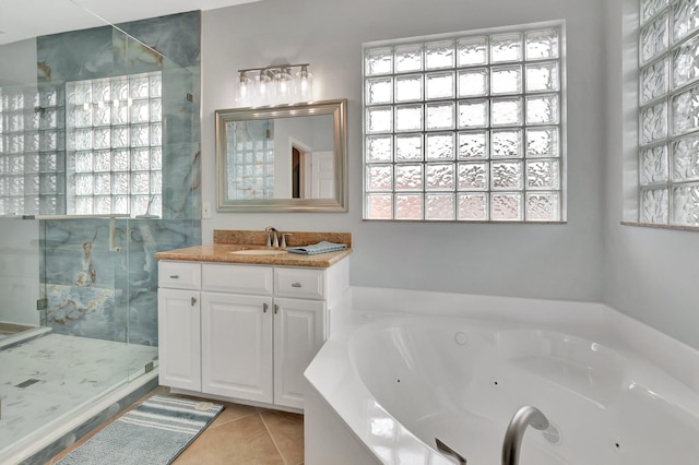 40 Country Lake Cir, Boynton Beach, FL 33436 - bathroom featuring a shower stall, healthy amount of natural light, tile patterned flooring, and a tub with jets