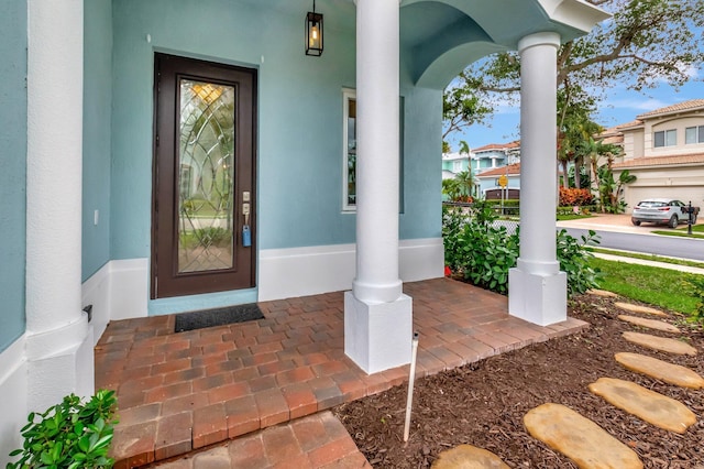 40 Country Lake Cir, Boynton Beach, FL 33436 - entrance to property featuring a porch and stucco siding