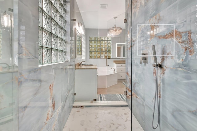 40 Country Lake Cir, Boynton Beach, FL 33436 - full bath with a marble finish shower, vanity, and a chandelier
