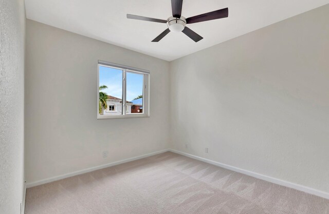 40 Country Lake Cir, Boynton Beach, FL 33436 - empty room with baseboards, light carpet, and a ceiling fan