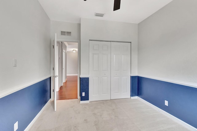 40 Country Lake Cir, Boynton Beach, FL 33436 - unfurnished bedroom featuring a closet, carpet flooring, ceiling fan, and baseboards
