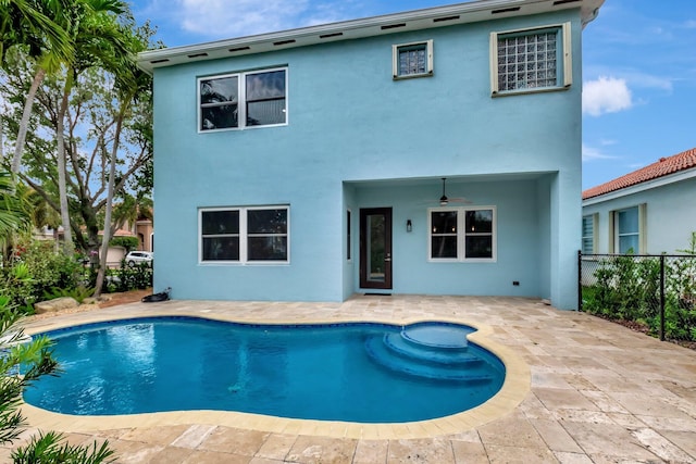 40 Country Lake Cir, Boynton Beach, FL 33436 - back of property with stucco siding, fence, an outdoor pool, a patio, and a ceiling fan