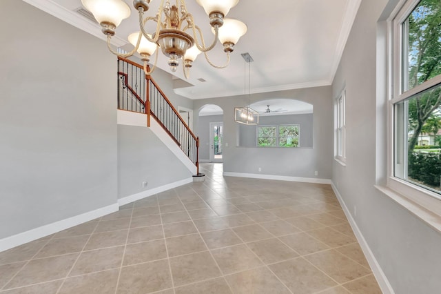 40 Country Lake Cir, Boynton Beach, FL 33436 - foyer entrance with a chandelier, arched walkways, ornamental molding, light tile patterned flooring, and baseboards